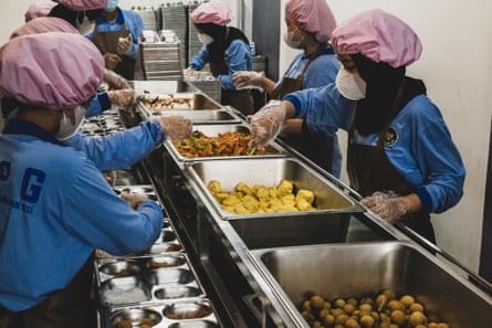 Workers prepare the free meals at a kitchen in Jagakarsa, South Jakarta, Indonesia, November 2025.