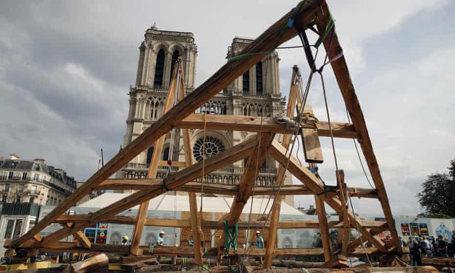 Carpenters put the skills of their Medieval colleagues on show on the plaza in front of Notre Dame Cathedral in Paris, France, Saturday, Sept. 19, 2020. Last July, Macron announced the spire would be reconstructed exactly as it was. 