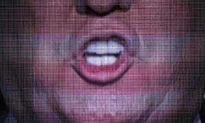 Donald Trump’s mouth is seen on a big screen