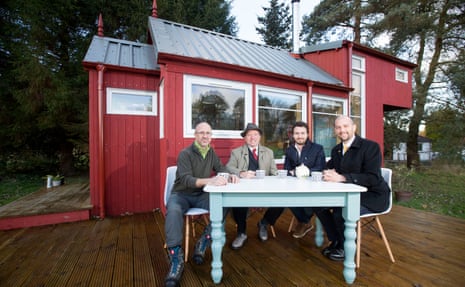 Designer Jonathan Avery, left, sits in front of a NestHouse prototype in Edinburgh with Social Bite’s Josh Littlejohn, second from right