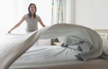 Woman making a bed