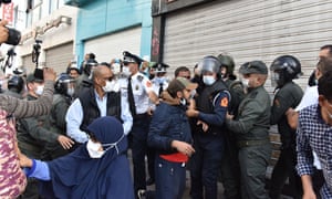 Security forces intervene in a protest against a government-imposed mandatory coronavirus vaccine mandate and vaccination certificate in Rabat, Morocco.