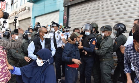 Security forces intervene in a protest against a government-imposed mandatory coronavirus vaccine mandate and vaccination certificate in Rabat, Morocco.