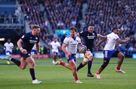 Antoine Dupont (centre) runs in to score France’s third try.