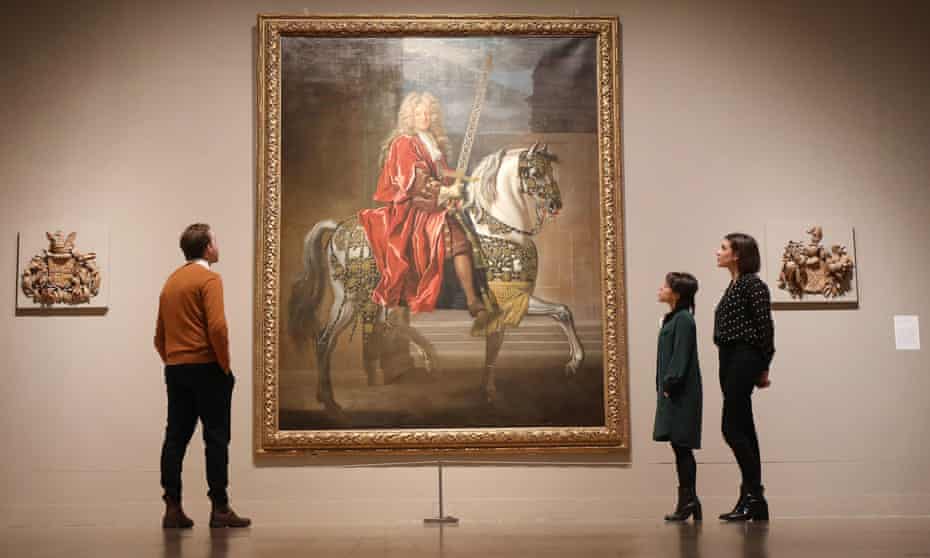 Visitors look at Equestrian Portrait of a Lord Mayor (c.1695-1705) by John Closterman, part of Tate Britain’s British Baroque: Power and Illusionexhibition.