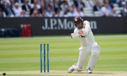 Jamie Smith hitting a cover drive for Surrey against Middlesex.