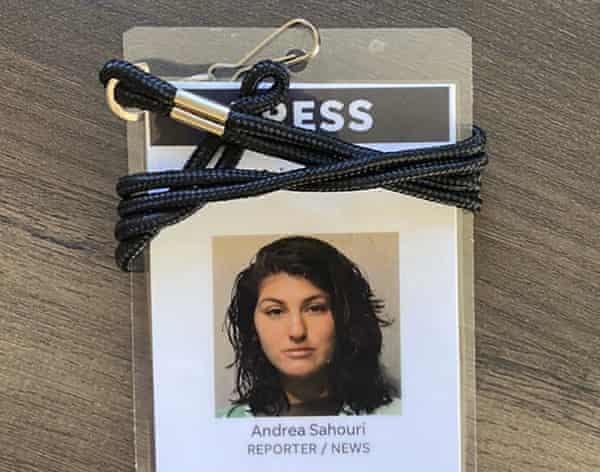 A press badge for Des Moines Register reporter Andrea Sahouri features her jail booking photo from her 31 May 2020 arrest.