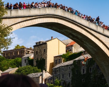 Mostar, Bosnia and Herzegovina ‘A jumper takes a dive from the Old Bridge, Mostar, possibly to escape the watching crowds and 40 degree heat.’
