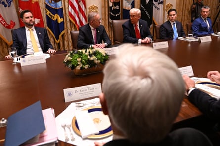 Australia’s ambassador to the US, Kevin Rudd (front), listens to Trump during a meeting with Albanese in the cabinet room at the White House in Washington DC.