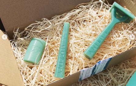 A shaving set packed in a box on wood shavings