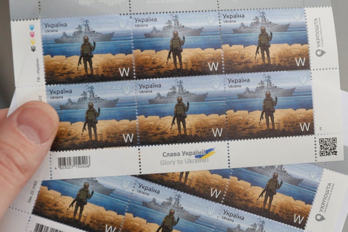 Postal stamps showing a Ukrainian service member and the Russian warship Moskva.