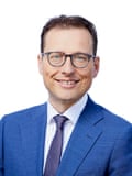 Passport-style photo of Martin Seidenberg