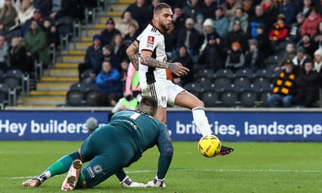 Layvin Kurzawa of Fulham slots the ball home to open the scoring as Hull City keeper Matt Ingram looks on.