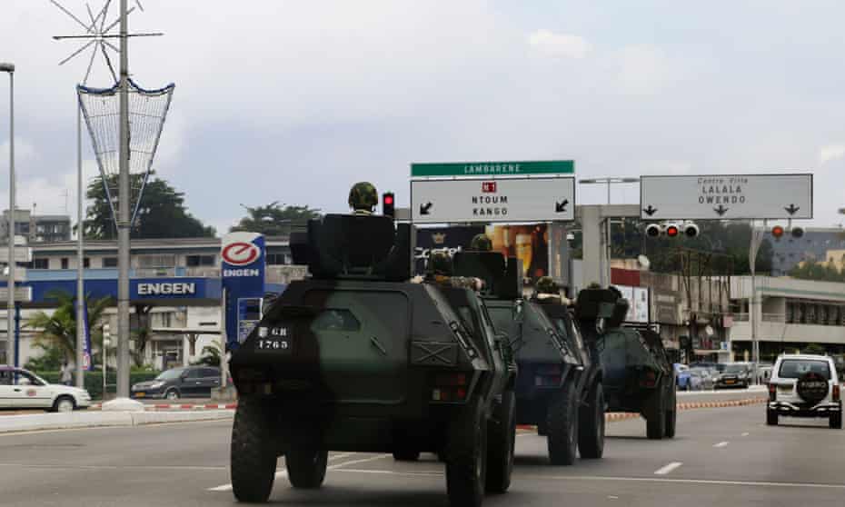 Armoured vehicles move through Libreville as Gabon awaits the official results of presidential election that both claim to have won.
