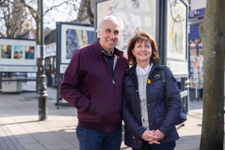 A man and a woman standing in a town centre