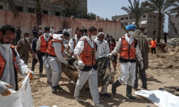 PALESTINIAN-ISRAEL-CONFLICT<br>People and health workers unearth bodies found at Nasser Hospital in Khan Yunis in the southern Gaza Strip on April 23, 2024 amid the ongoing conflict between Israel and the Palestinian militant group Hamas. (Photo by AFP) (Photo by -/AFP via Getty Images)