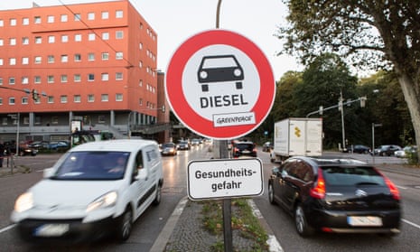 Unofficial traffic signs warn about the danger of pollution caused by diesel cars at a demonstration for cleaner air in Stuttgart, Germany, last October.