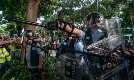Police charge protesters after a rally in Sheung Shui on Saturday