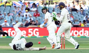 Australia’s Marnus Labuschagne knocks a shot past England’s Ben Stokes as Jos Buttler looks on.