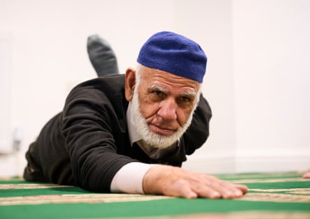 A man takes part in the weekly pilates class at the Jamia Usmania mosque.