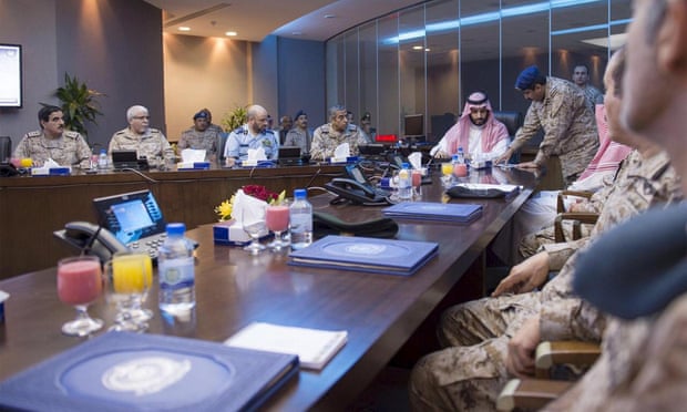 Saudi Defence Minister Prince Mohammad bin Salman is briefed by officers on the military operations in Yemen at the command center in Riyadh