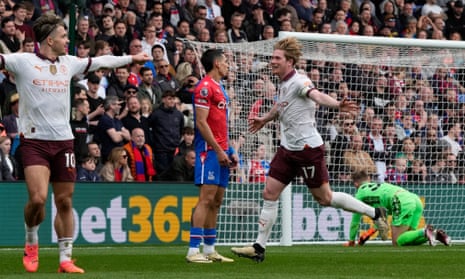Manchester City's Kevin De Bruyne (centre right) celebrates with Jack Grealish after scoring their fourth goal at Crystal Palace, his second goal of the game.