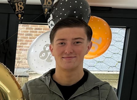 Henry Nowak at a birthday party surrounded by balloons.
