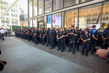 rows of many people in police uniforms