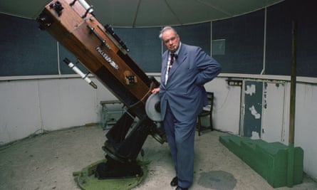 Patrick Moore with his telescope. 