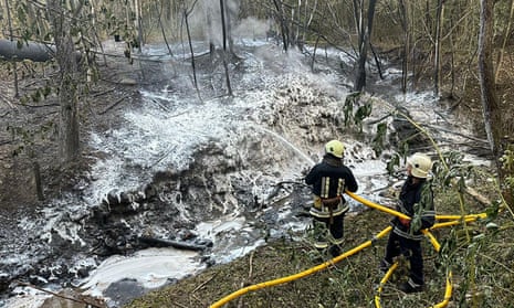 Emergency workers putting out the fire at an oil pipeline in western Ukraine’s Ivano-Frankivsk region