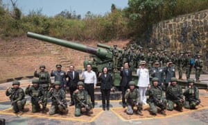 Taiwanese President Tsai Ing-wen poses with military personnel last month.