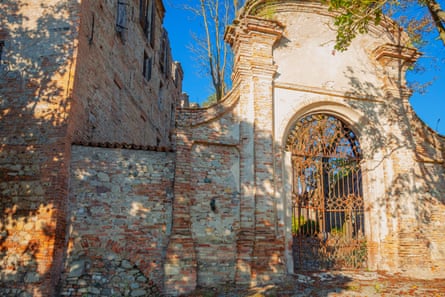An old gateway and walls of a medieval castle in Italy