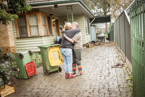Angelica Prpa hugs a neighbour after flood waters ruined her home in Maribyrnong.