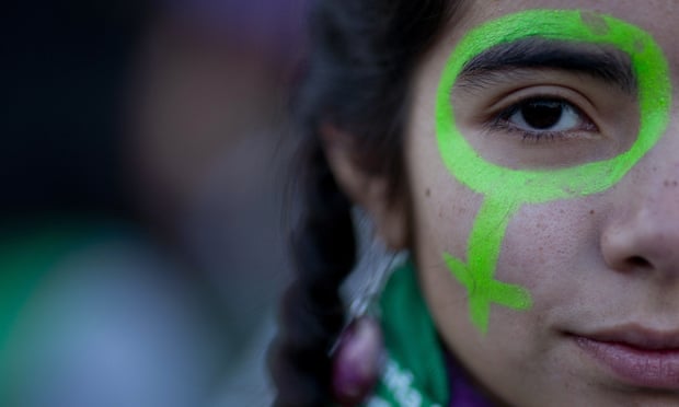 A protester poses for a photo during a march in Buenos Aires on 4 June where demonstrators demanded and end to violence against women and legal abortion.