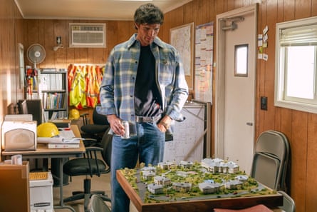 Jacob Elordi as Nate in Euphoria, looking at an architectural diorama.