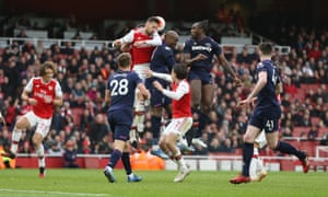 Arsenal and West Ham players vie for the ball in their March 2020 Premier League match