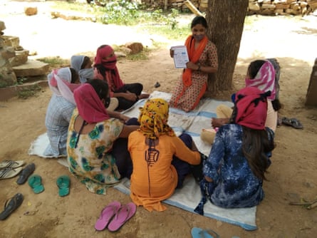 Priyanka Bairwa holds a meeting on caste and gender discrimination in her village Ramathra