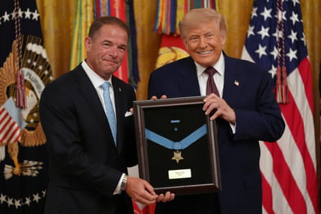 Donald Trump grinned as he presented the Medal of Honor to Tom Ripley, who accepted on behalf of his late father, Marine Colonel John W Ripley, in the East Room of the White House on Thursday.