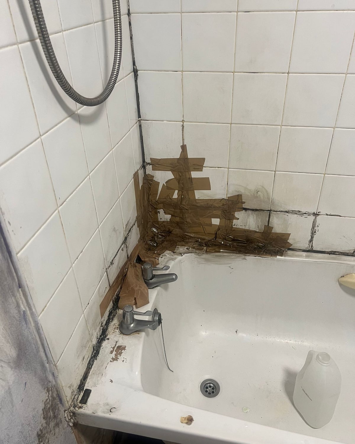Black mould in the corner of a bath/tiling