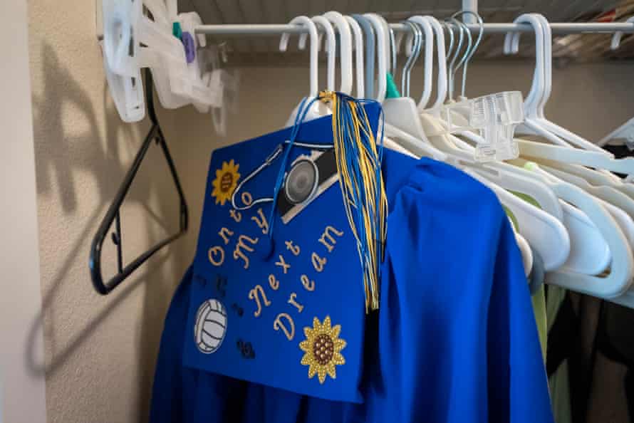 Sierra’s graduation cap and gown hangs in her room in Orange County, California. Sierra started high school in 2016 while homeless with her mom and faced daily challenges of finding food, shelter and staying clean to feel normal.