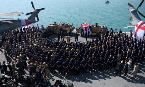 Theresa May addresses sailors on board HMS Ocean during her trip to attend the Gulf Cooperation Council summit in Bahrain.