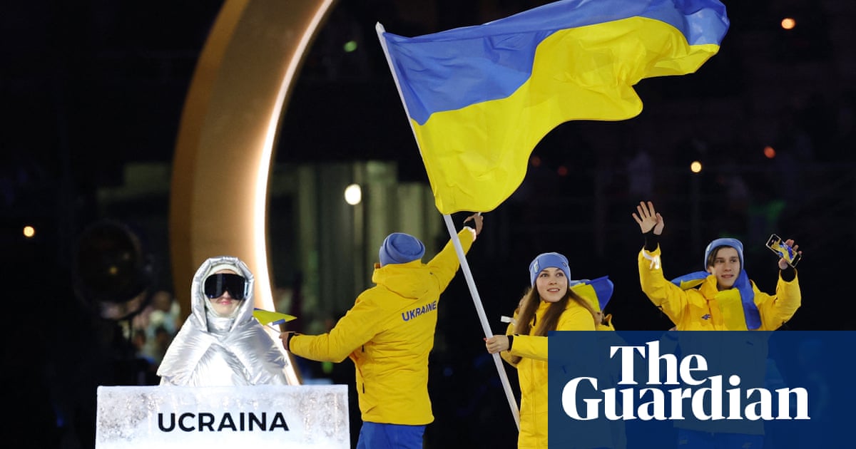 Russian woman carried Ukraine team placard at Winter Olympics opening ceremony