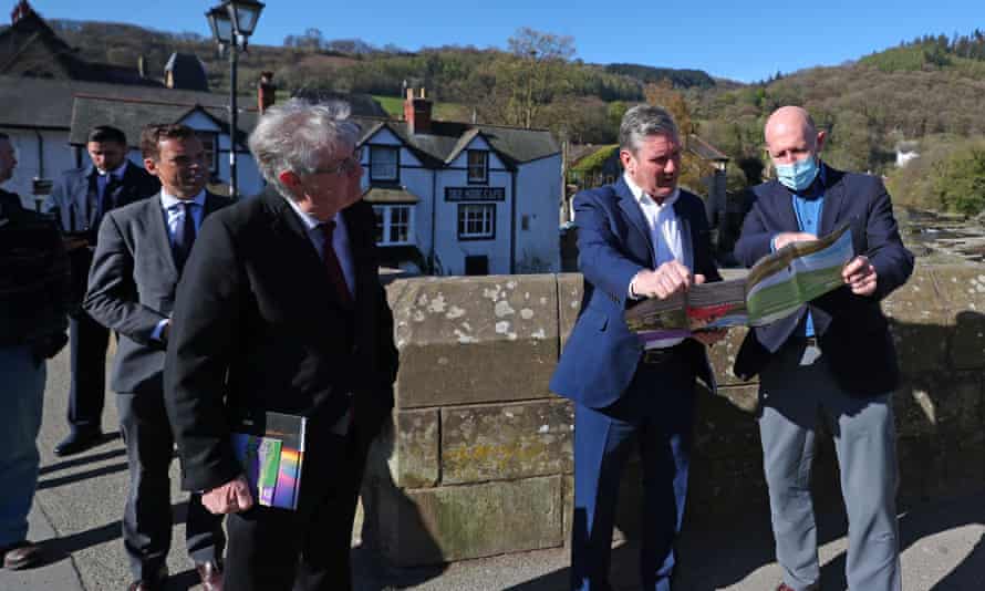 First minister of Wales, Mark Drakeford, with Labour’s leader, Keir Starmer, and AONB partnership chair, Andy Worthington, during a walkabout in Llangollen for Welsh Labour’s Senedd election campaign