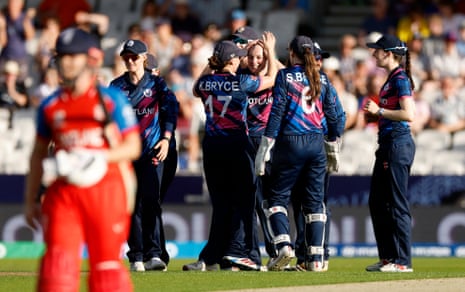 Hannah Rainey celebrates with teammates after taking the wicket of Alice Capsey.