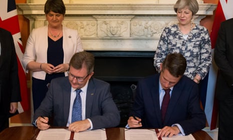 Arlene Foster and Theresa May oversee the signing of their pact, at No 10 last week.