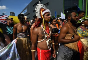 Protesters in traditional pacific islands attire march during the Global Strike for Climate rally in Brisbane.