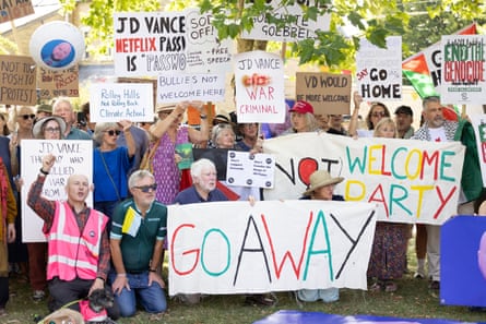 Anti-Vance protesters with banners saying ‘go away’