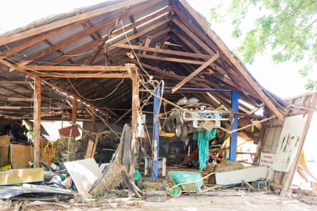 car mechanics workshop with roof collapsed in