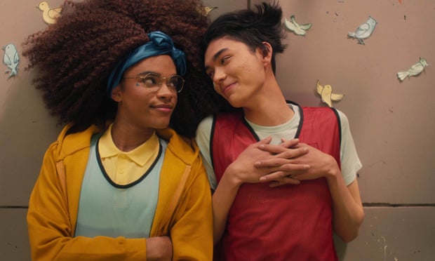 Heartstopper trans actor Yasmine Finney plays transgender character El Argent, with William Gao lying on the floor next to him playing Tao, with paper butterflies all around.