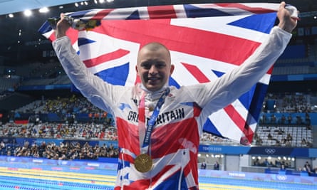 Adam Peaty poses with his 100m breaststroke gold at the Tokyo Olympics in 2021.